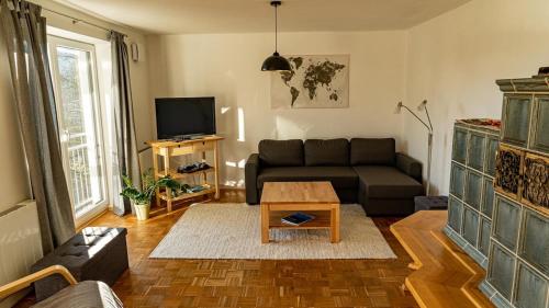 a living room with a couch and a coffee table at Apartment Nanni in Kirchanschöring