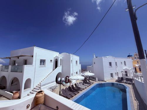a view of a hotel with a swimming pool at Hotel Hellas in Fira