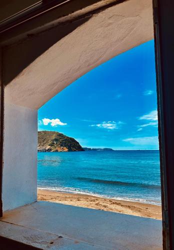 a window view of the ocean from a beach at Lido Di Procida Guest House in Procida