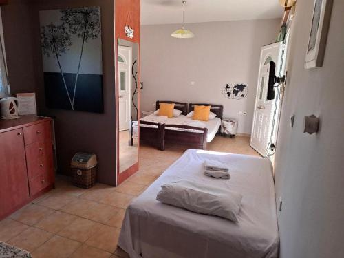 a living room with a bed and a couch at Belleza Villa in Lixouri