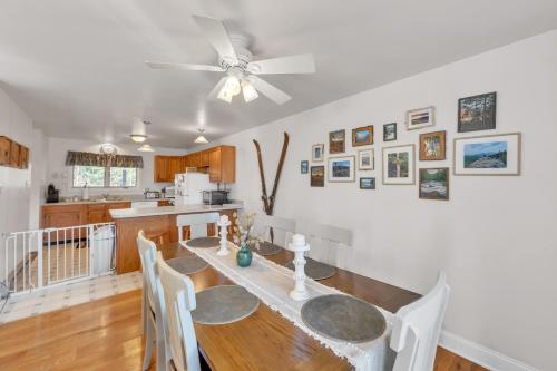 a dining room with a table and a ceiling fan at Uncas 16N - Spacious & Scenic Townhome in North Creek