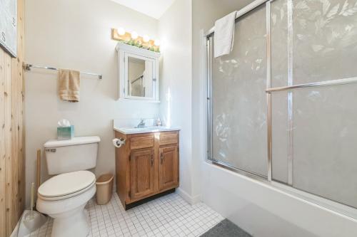 a bathroom with a toilet and a shower at Uncas 16N - Spacious & Scenic Townhome in North Creek