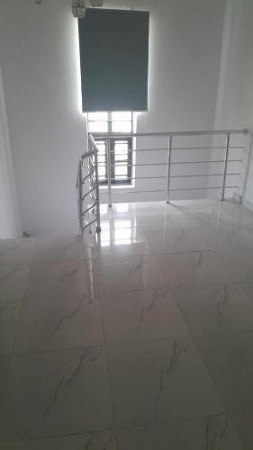 a room with white marble floors and a sign at homes of Florence in Ikota