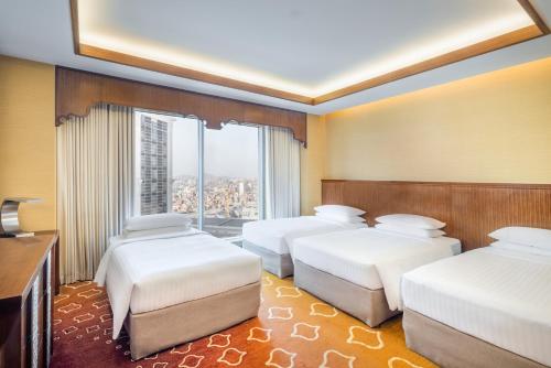 Postel nebo postele na pokoji v ubytování Marriott Hotel Jabal Omar Makkah