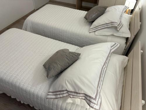 two beds with pillows on top of each other at Apartment Anđelina, Split in Split