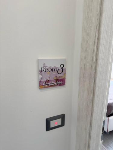 a sign on a wall in a room at Dear Mary, B&B romantico vicino Lecce nel cuore del Salento in San Cesario di Lecce