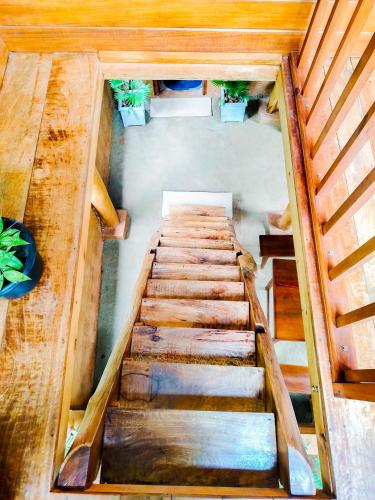 an overhead view of a wooden staircase in a room at Sigiriya Eco Tree House in Sigiriya