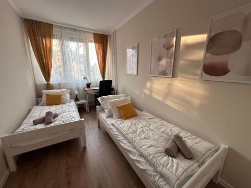 Ένα ή περισσότερα κρεβάτια σε δωμάτιο στο Deer Apartment