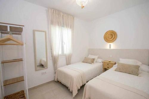 Postel nebo postele na pokoji v ubytování Casa Marinero beach 1