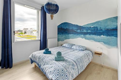 a bedroom with a bed and a large window at Jardin du 8e Ciel - Neuf & Central in Nantes
