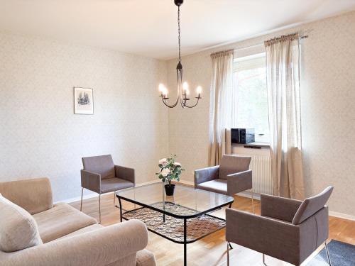 TV a/nebo společenská místnost v ubytování Säffle Suites by Svaneholm Hotel
