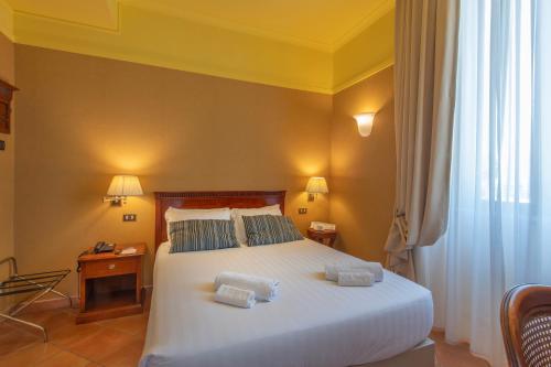 Una cama o camas en una habitación de Hotel Nuvò