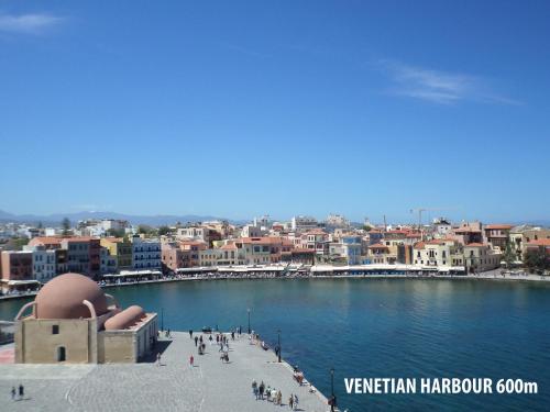 a view of a city with a body of water at Tina Hotel in Chania Town