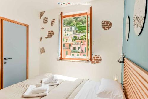 Postel nebo postele na pokoji v ubytování Blue Lemon, TerreMarine