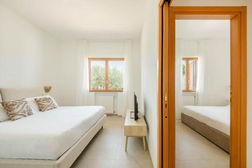 Ένα ή περισσότερα κρεβάτια σε δωμάτιο στο Villa Luce Luxury Accomodation