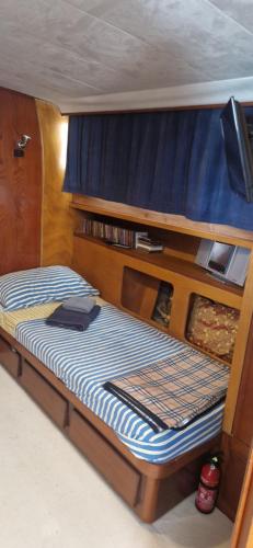 a bed in the back of a boat at Salvador BAHIA Boat and Breakfast in Lido di Ostia