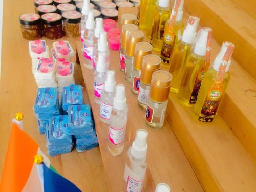a group of bottles of cleaning products on a shelf at Kasbah Alami in Kalaat MGouna