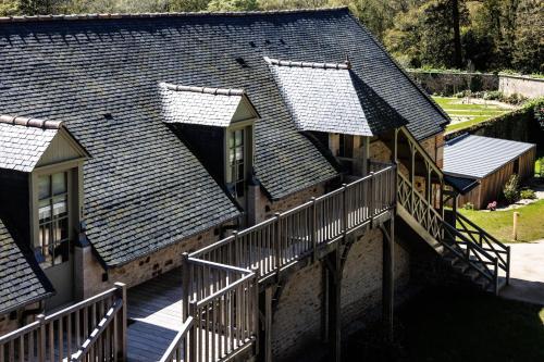 an overhead view of a group of houses with a deck at Domaine de Locguénolé & Spa - Relais & Chateaux in Kervignac