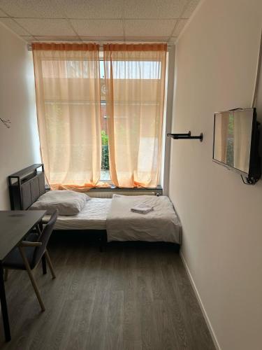 Postel nebo postele na pokoji v ubytování HH Hostels