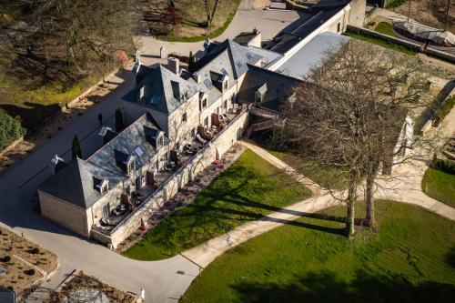 an aerial view of a large house with a tree at Domaine de Locguénolé & Spa - Relais & Chateaux in Kervignac