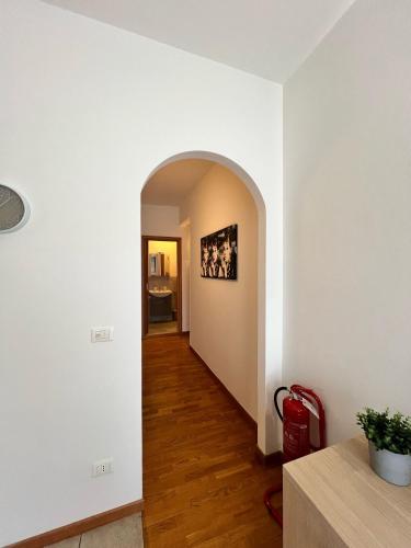 a hallway with an archway in a house at Scandicci Apartment in Scandicci