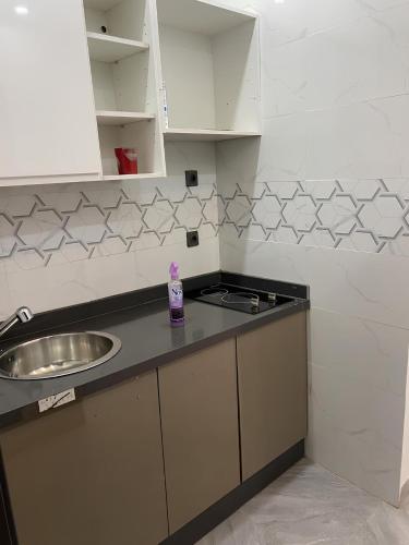 a kitchen with a sink and a counter top at Chambre meublée avec balcon 3S Ngor Almadies Dakar in Dakan