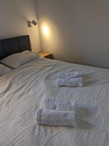 two towels sitting on top of a bed at Benemanuel Oasis in Beer Sheva