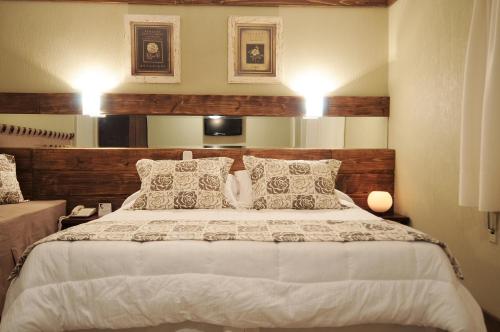 Postel nebo postele na pokoji v ubytování Sky Centro Hotel & SPA