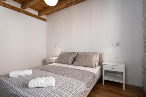 Ένα ή περισσότερα κρεβάτια σε δωμάτιο στο Apartments Eliza
