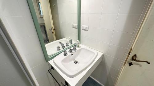 a bathroom with a sink and a mirror at Tiny Elephant Mini suite in Rome in Rome
