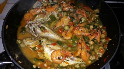 a pan of food with shrimp and vegetables in it at Le Radici Casa Vacanze in Copertino