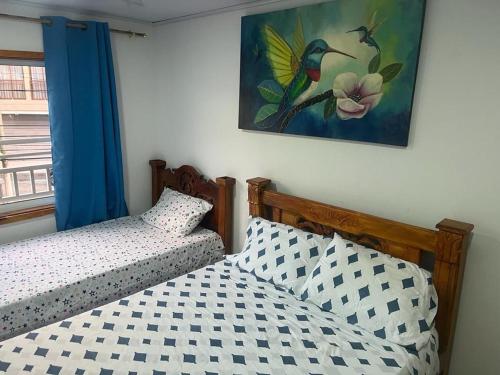 Postel nebo postele na pokoji v ubytování Apartamentos Manatwar