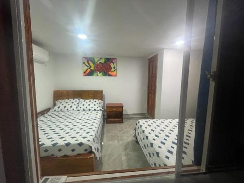 Postel nebo postele na pokoji v ubytování Apartamentos Manatwar