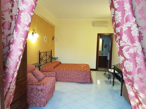 Postel nebo postele na pokoji v ubytování Hotel A Pinnata