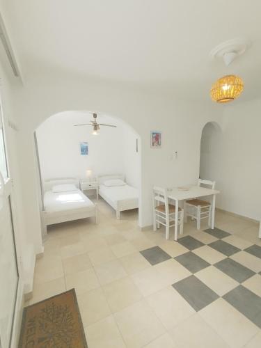 Postel nebo postele na pokoji v ubytování Dandelion Paros Apartments III-IV