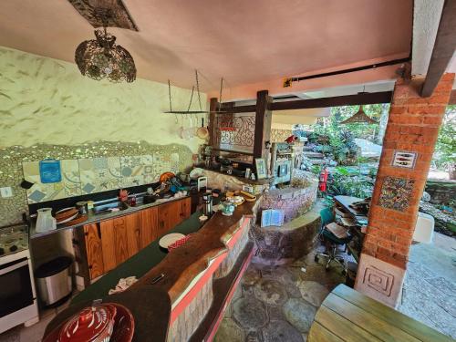 a living room with a couch and a table at Canto Verde Pousada in Lençóis