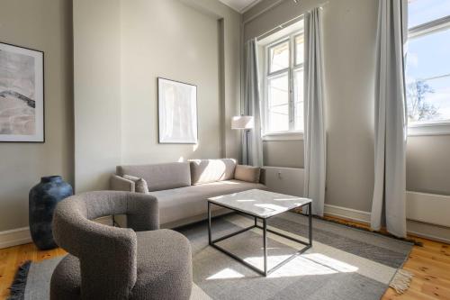 a living room with a couch and a table at Centrally Located 3 Bedroom Apartment in Copenhagen