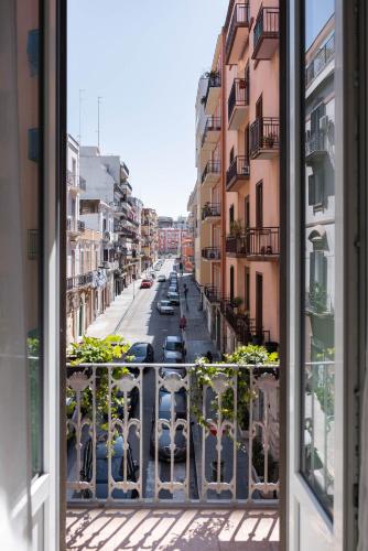 a view of a city street from a balcony at SUN HOUSE in Bari