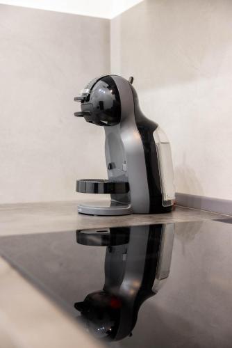 a black and silver object sitting on top of a table at SUN HOUSE in Bari
