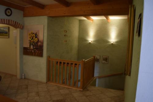 a room with a staircase in a house at Penzión Stefanshof in Kremnica