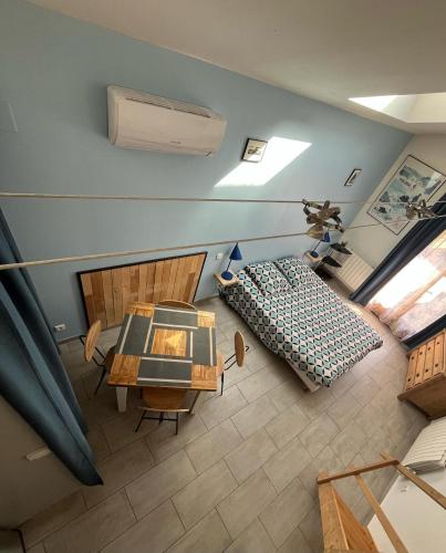 an overhead view of a bedroom with a bed and a table at Cathy et Eric in Beaurevoir