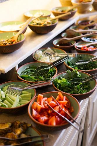 a buffet filled with different types of vegetables in bowls at Heybe Hotel & Spa in Goreme