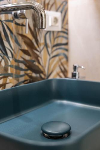 a bathroom sink with a blackvisoruationropheropheropheropheropheropheropherophe at SUN HOUSE in Bari