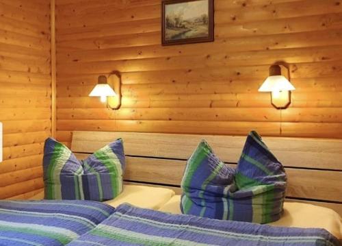 a bedroom with two beds and two pillows at Ferienhaus Petra in Elbingerode