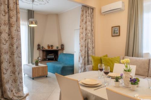 a living room with a table and a couch at Zafferana's Pool Retreat in Zafferana Etnea