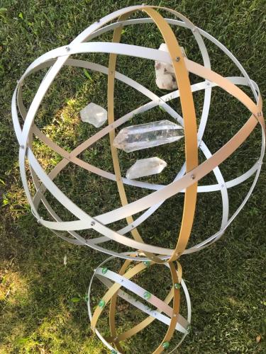 a metal object on the grass with rocks in it at BED & BREAKFAST Orizzonte in Caorle