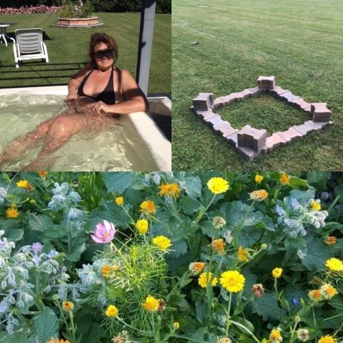 a woman sitting in a bath tub next to flowers at BED & BREAKFAST Orizzonte in Caorle