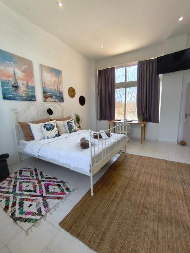 Katil atau katil-katil dalam bilik di Spacious Beach House Theologos