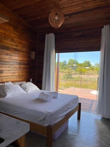 Giường trong phòng chung tại Casa em Maraú - balangan