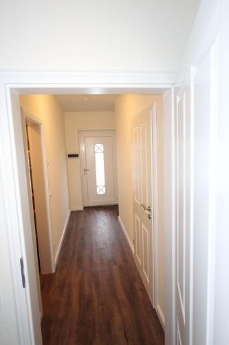 an empty hallway of an apartment with a door at Arnis-EG-Nr-1 in Haby